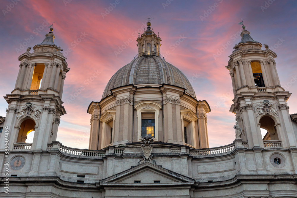 Architecture Piazza navona in rome, italy. Church dome with pink skies at evening.