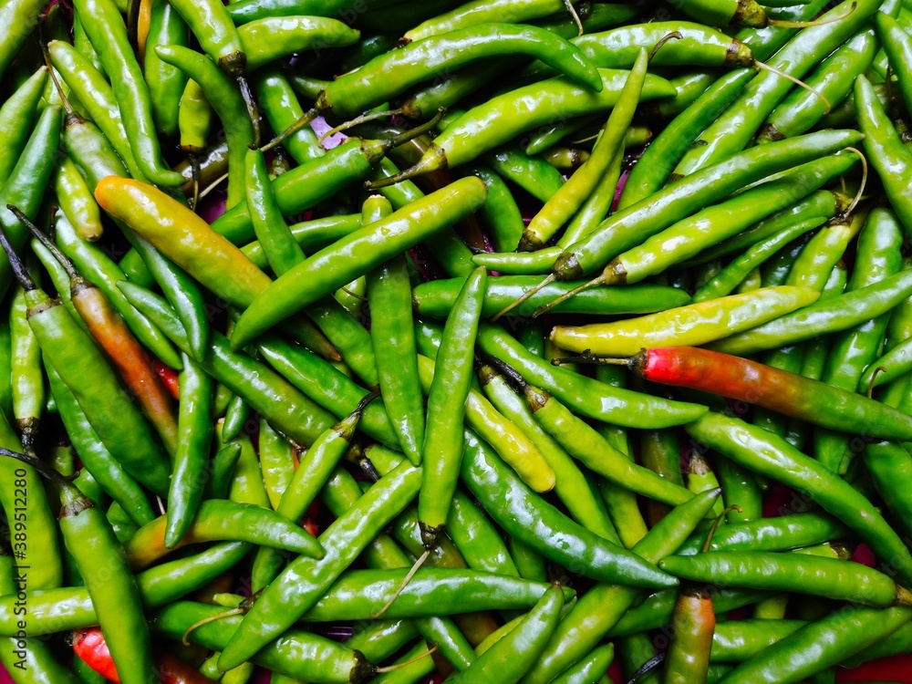 Fresh green chillies spicy pepper background Fresh green chillies spicy pepper background