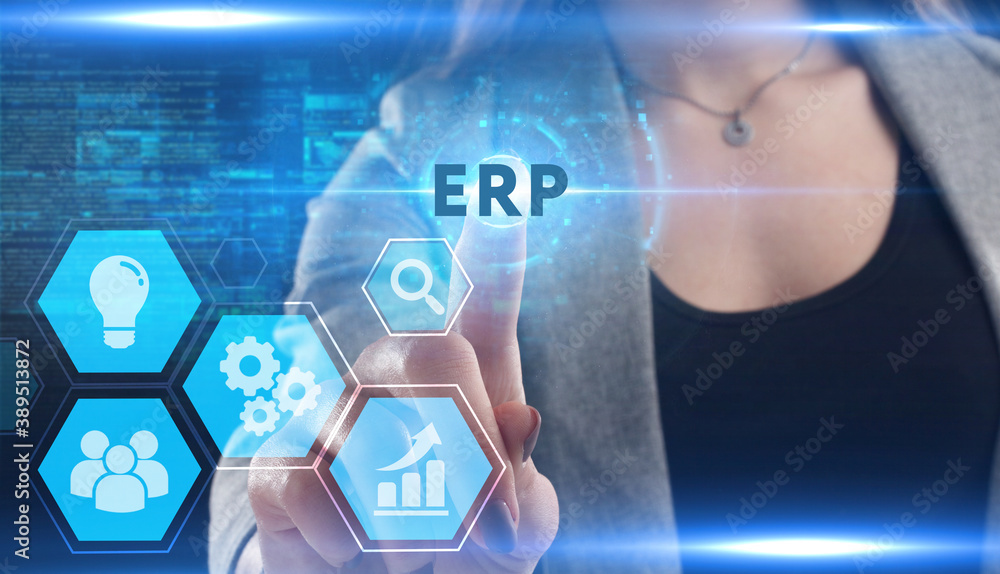 Business, Technology, Internet and network concept. Young businessman working on a virtual screen of the future and sees the inscription: ERP Business, Technology, Internet and network concept. Young businessman working on a virtual screen of the future and sees the inscription: ERP