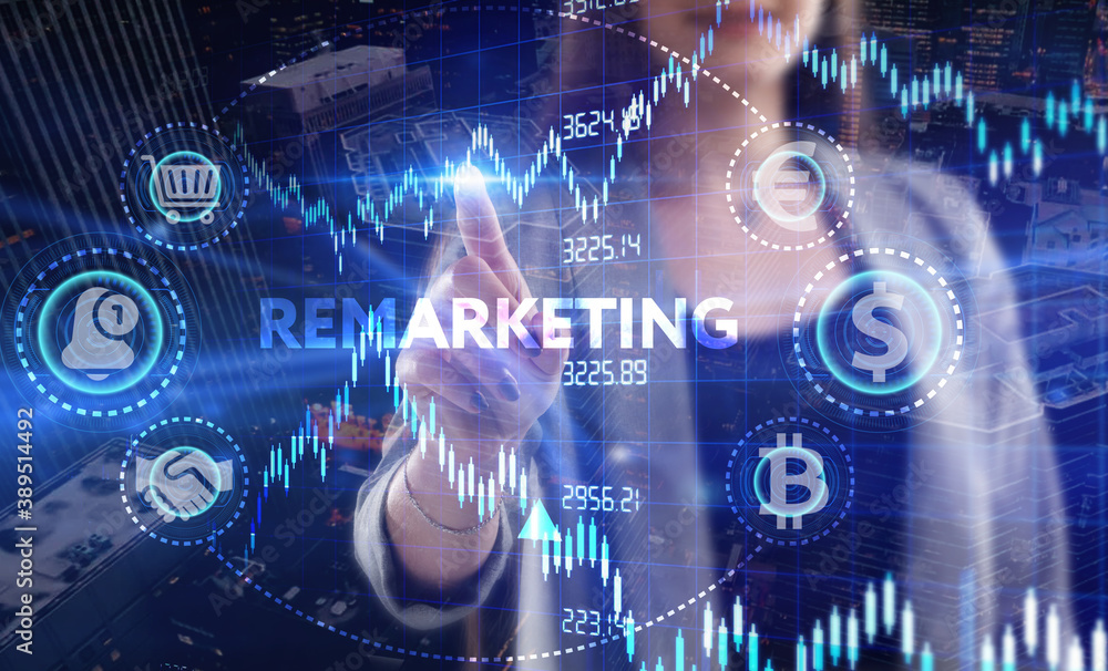 Business, Technology, Internet and network concept. Young businessman working on a virtual screen of the future and sees the inscription: Remarketing Business, Technology, Internet and network concept. Young businessman working on a virtual screen of the future and sees the inscription: Remarketing