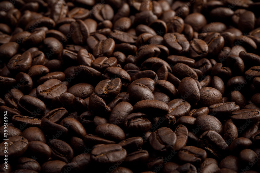 The hot of brown roasted coffee beans on brown background with copyspace, Healthy products by organic natural ingredients concept The hot of brown roasted coffee beans on brown background with copyspace, Healthy products by organic natural ingredients concept