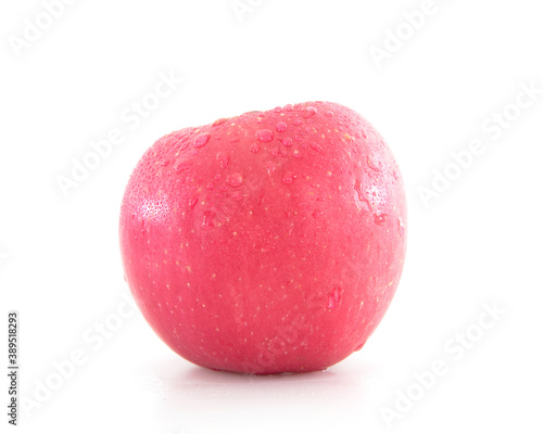 A red apple with water drops on white background