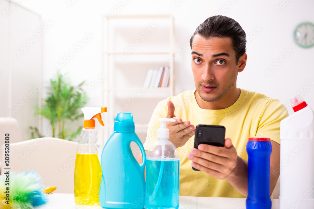Young male contractor doing housework at home Young male contractor doing housework at home