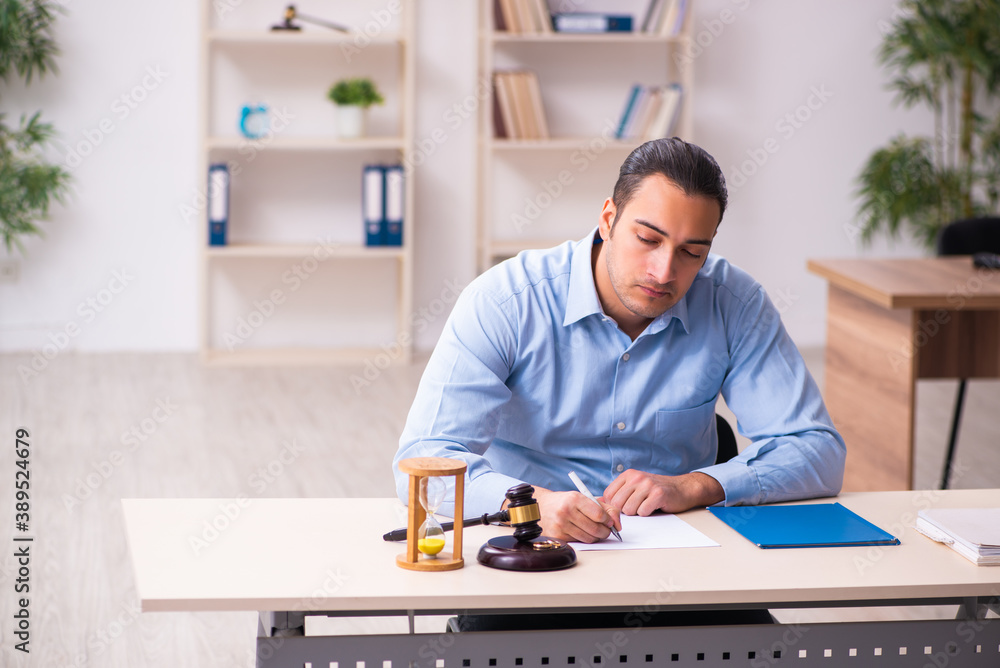 Young man in courthouse in divorcing concept Young man in courthouse in divorcing concept