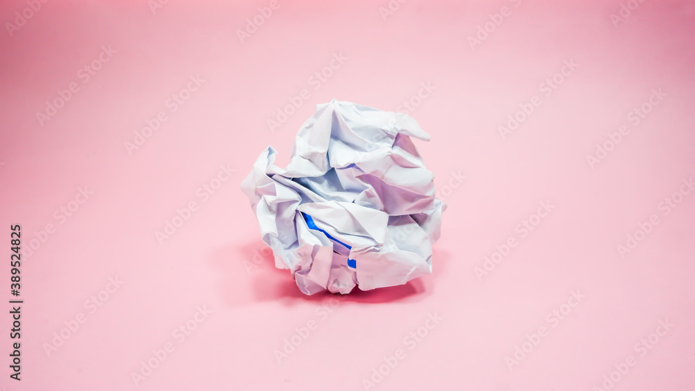 Crumpled paper in pink background Crumpled paper in pink background