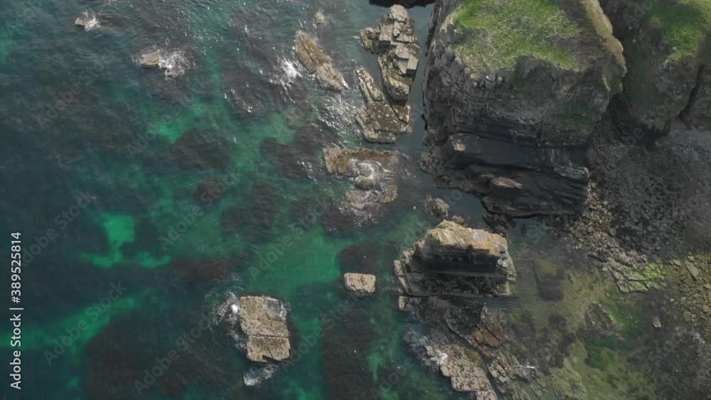Aerial view of a rocky beach in Scotland. Aerial view of a rocky beach in Scotland.
