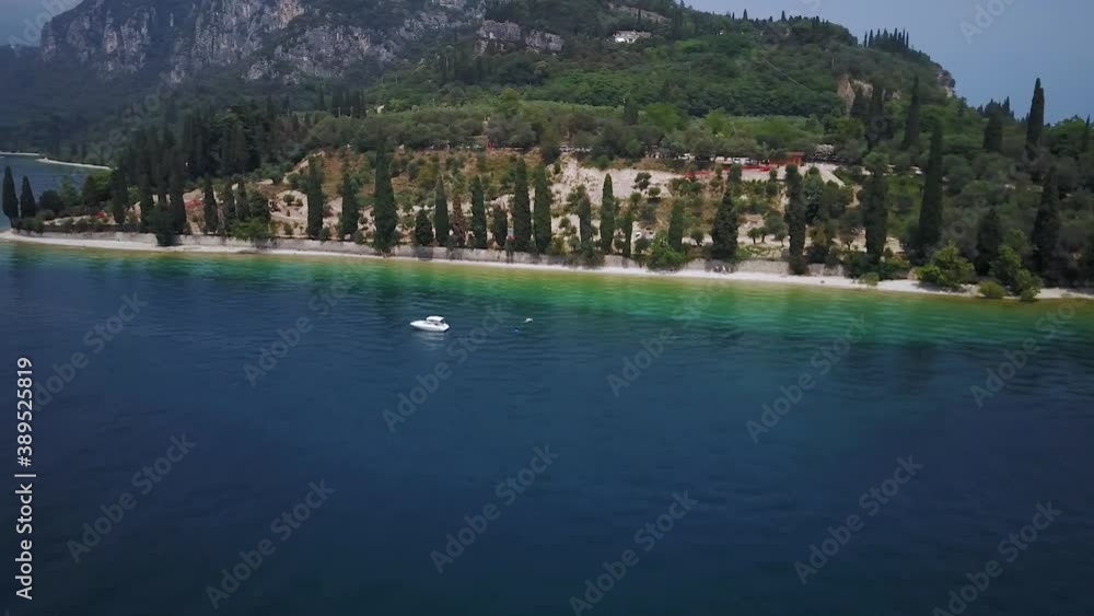 Aerial drone view of a colorful lakeside, peaceful tourism destination Aerial drone view of a colorful lakeside, peaceful tourism destination