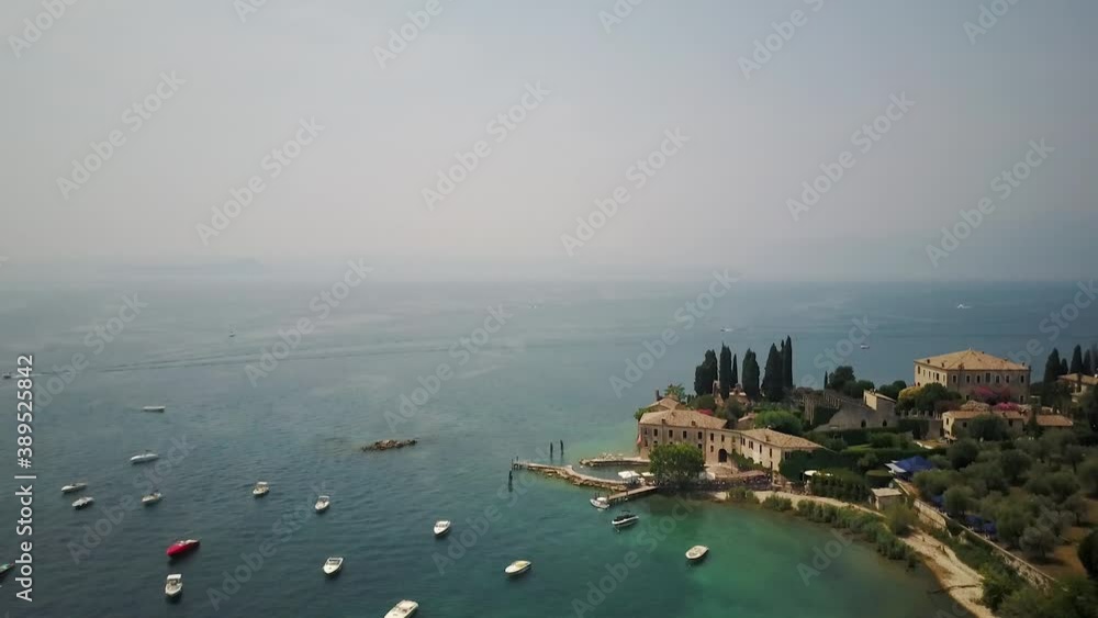 Aerial, flying over the pristine shores on Lago di Garda in Northern Italy Aerial, flying over the pristine shores on Lago di Garda in Northern Italy