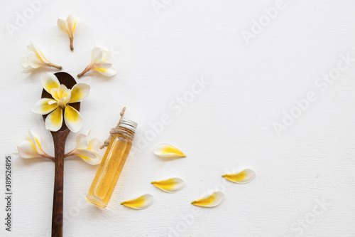 natural herbal oils from flower frangipani smells scents aroma arrangement flat lay style on background white