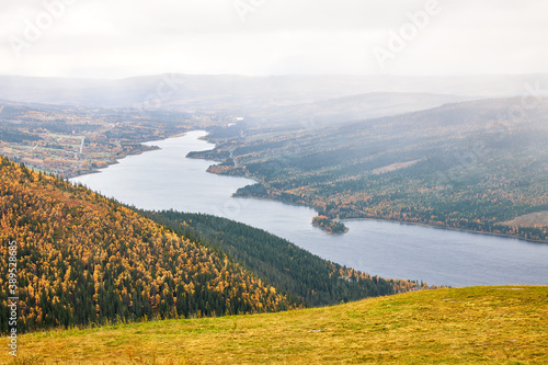 Autumnal view from the high mountains in Åre with view over the Åre lake and autumnal mountain landscape of the Swedish county Jämtland.