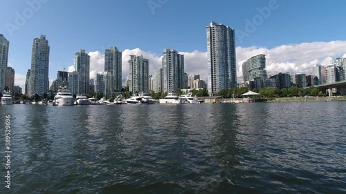 marineside crescent ocean harbor quayside marina gazebo with luxury vessels cruise ships sail boats docked at a modern condo residential area of the downtown city by hotels casinos and a bridge 1-3 photo