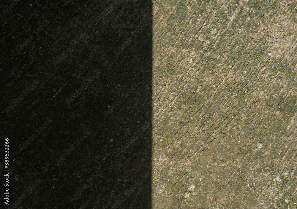 Obraz premium Shadow and sunlight on the cement floor