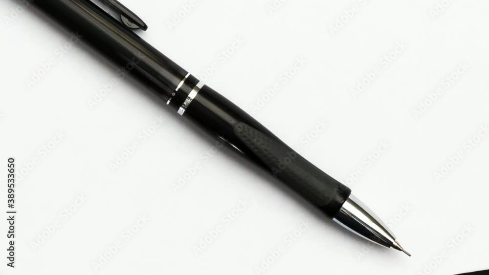 A blank sheet of paper and a black mechanical pencil. A blank sheet of paper and a black mechanical pencil.