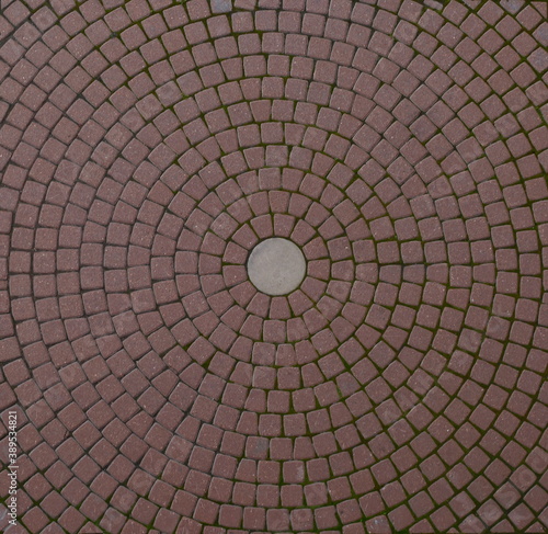 Red paving slabs laid in circles