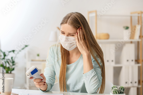 Woman with infrared thermom...