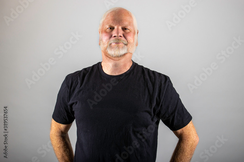 Portrait of mature, old man with gray and white beard and hair