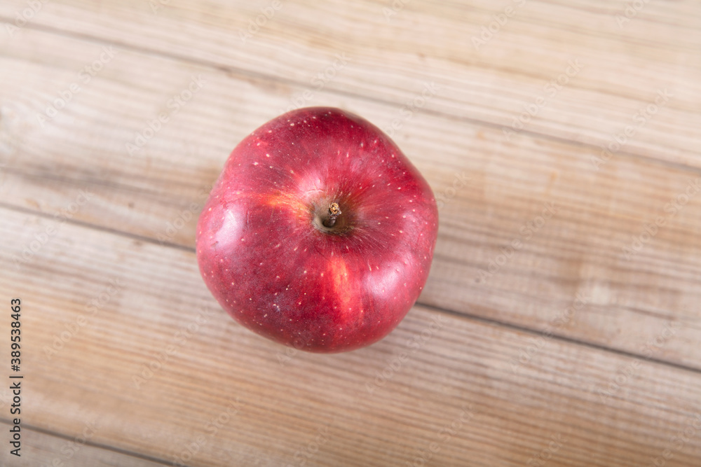 Looking down and shooting a red apple on the table Looking down and shooting a red apple on the table