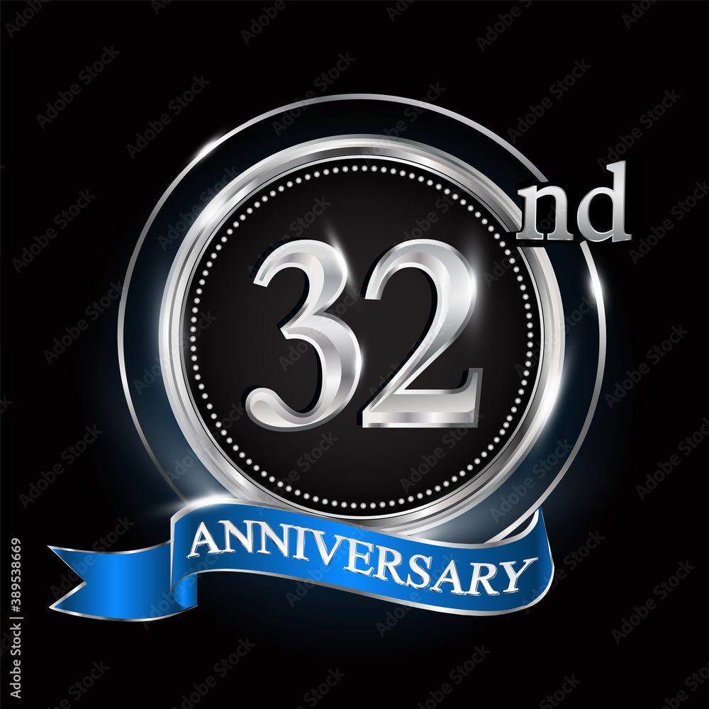 32nd anniversary logo with silver ring and blue ribbon. 32nd anniversary logo with silver ring and blue ribbon.