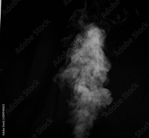 White smoke on black background. Abstract background, design element, for overlay on pictures