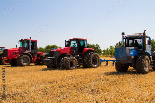 Agricultural tractor plowing a field