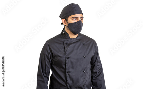 Chef in coronavirus days. Young person with face protection mask isolated on white background.