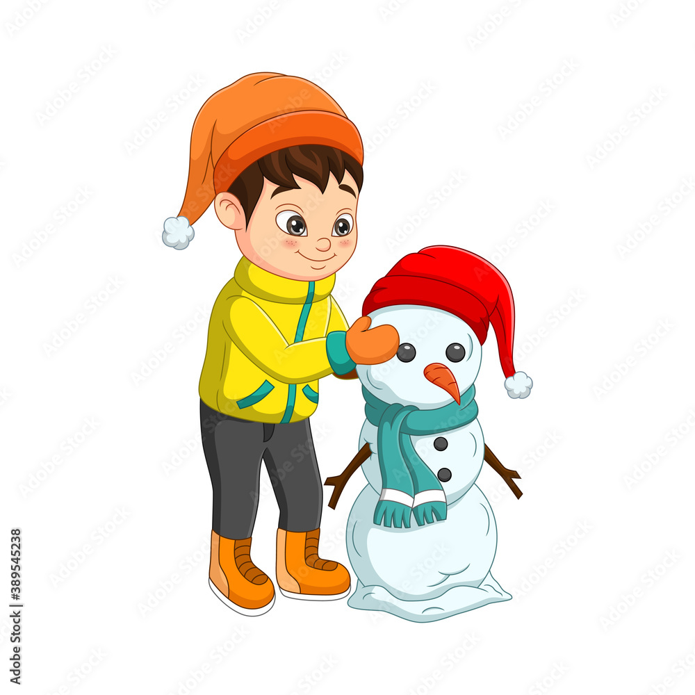 Cute little boy building a snowman
