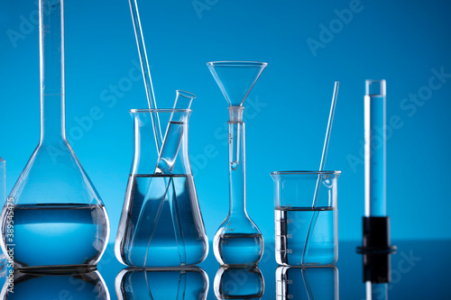 Science concept. Laboratory equipment composition. Test tubes on blue background.