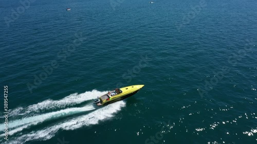 Wallpaper Mural Yellow boat movement on blue water, boat top view video 4k Torontodigital.ca
