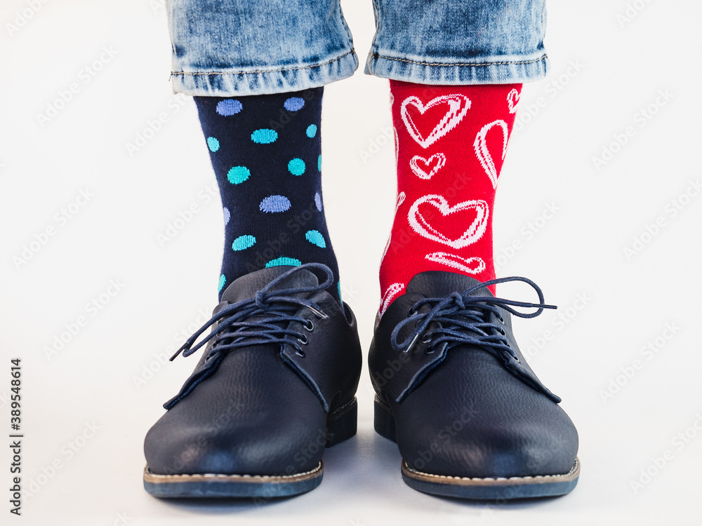 Men's legs, trendy shoes and bright socks. Close-up. Style, beauty and elegance concept Men's legs, trendy shoes and bright socks. Close-up. Style, beauty and elegance concept