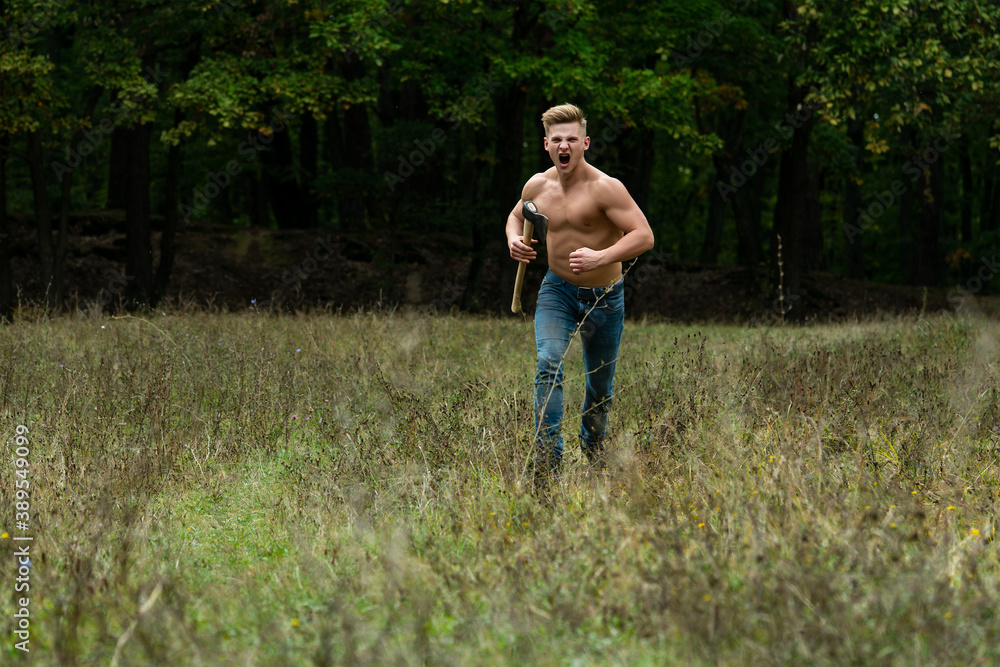 Lumberjack muscled young man run. Shirtless athletic naked guy running, nature outside.