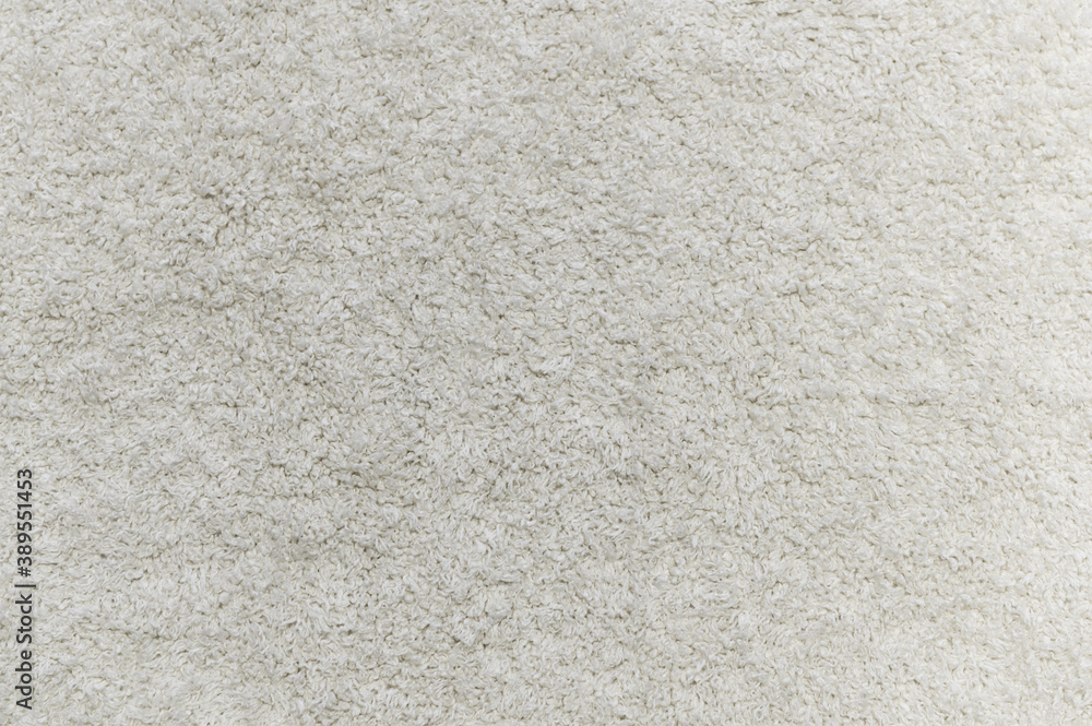 Close up of white carpet. Top view of texture of white foot scraper. background.