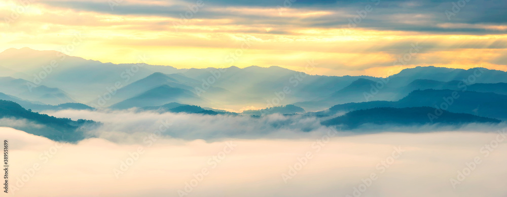 Panorama view of mountain and fog with sun rays in morning sunrise, Beautiful landscape of natural