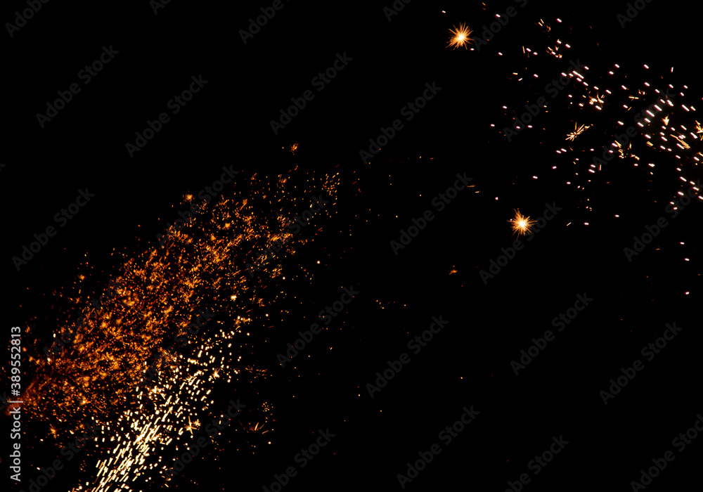 blurry sparks from fireworks on black background blurry sparks from fireworks on black background