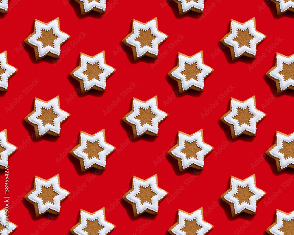 Star pattern. Red seamless background. Brown gingerbread biscuit with white icing minimalist symmetrical composition wallpaper for kids. Modern contrast ornament isolated on bright.