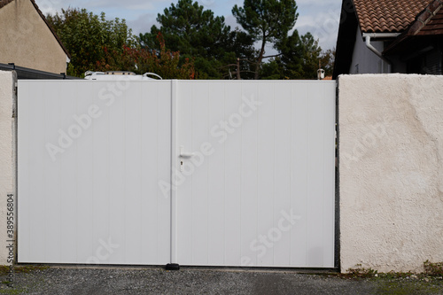 white door pvc plastic gate portal of suburb house