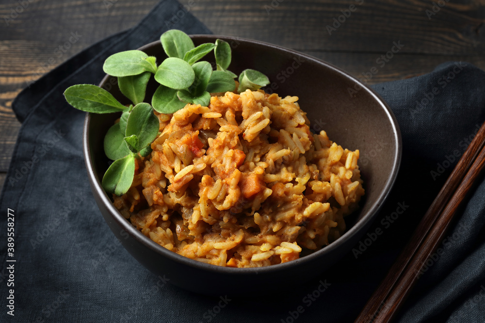 Spicy mujadra with rice, orange lentils, carrots, onions and borago sprouts Spicy mujadra with rice, orange lentils, carrots, onions and borago sprouts