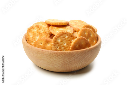 Obraz na płótnie Wooden bowl with cracker biscuits isolated on white background