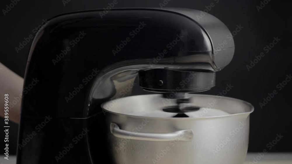 Making icing for a cake with a food mixer. Making icing for a cake with a food mixer.