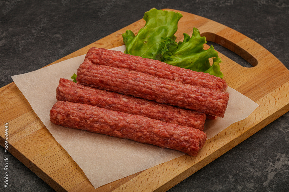 Raw beef sausages with spices
