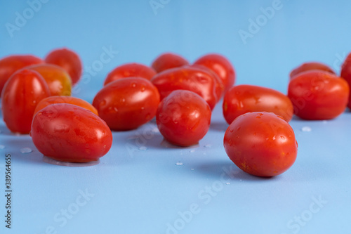 Group of Cherry Tomatoes isolated on blue background
