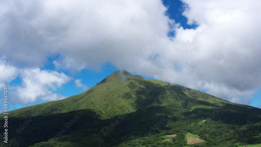 Highest mountain in Martinique volcano Pelee with clouds sunny day Highest mountain in Martinique volcano Pelee with clouds sunny day