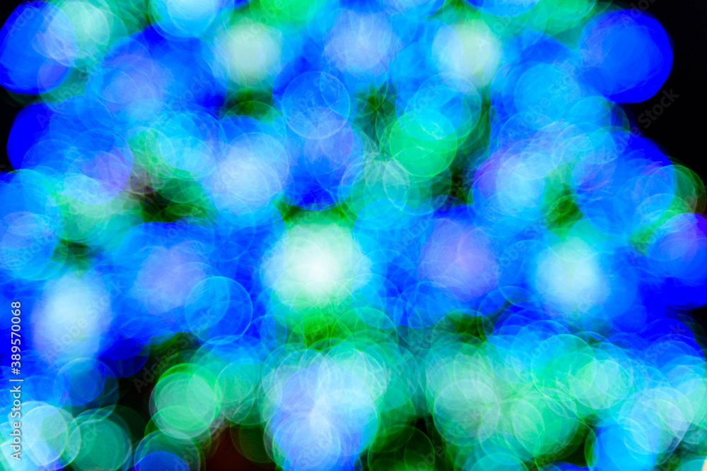 Background of the blurred colorful christmas lights. Bokeh pattern Background of the blurred colorful christmas lights. Bokeh pattern