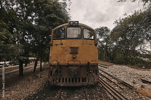 ld yellow diesel locomotive train at public station..
