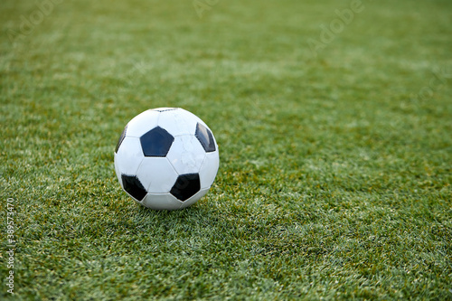 close-up photo of ball on grass in stadium, sport and football, soccer concept