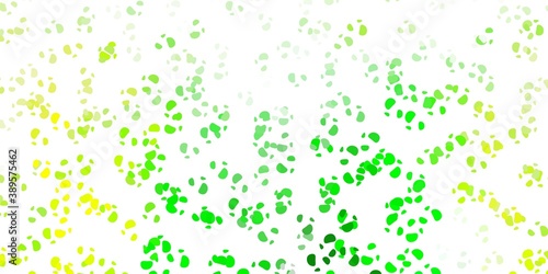 Light green  yellow vector pattern with abstract shapes.