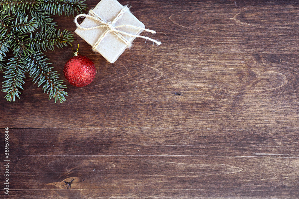 New Year's background. Spruce branches on a wooden table. Ornaments for the New Year tree. Christmas concept. New Year's background. Spruce branches on a wooden table. Ornaments for the New Year tree. Christmas concept.