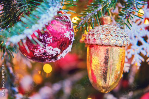 New year and Christmas tree decorations with big golden acorn and red ball