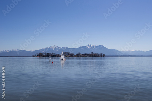 travel germany and bavaria, view at Fraueninsel, Chiemsee and mountains, Bavaria, Germany