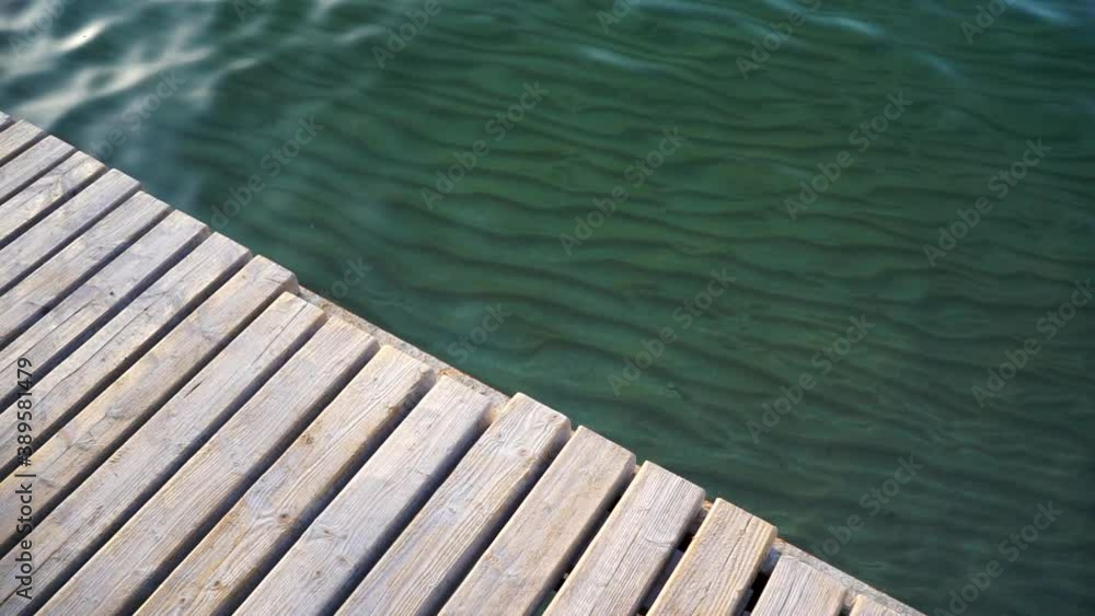 Beautiful shining ripples of sea or ocean water, splashing and rolling to the shore on a sunny day on a natural background. Calm in the sea Beautiful shining ripples of sea or ocean water, splashing and rolling to the shore on a sunny day on a natural background. Calm in the sea