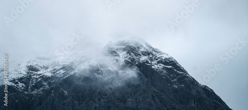 Snowy mountain on a misty day